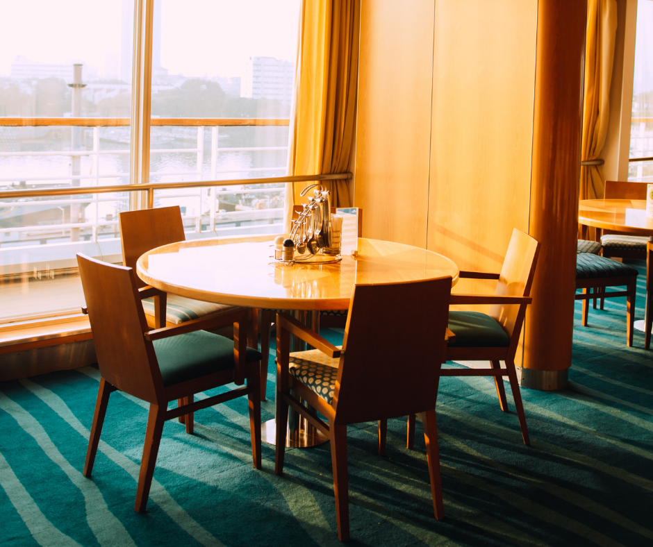 dining table by a window with four chairs